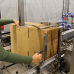 End-of-line packaging automation system improving manufacturing efficiency